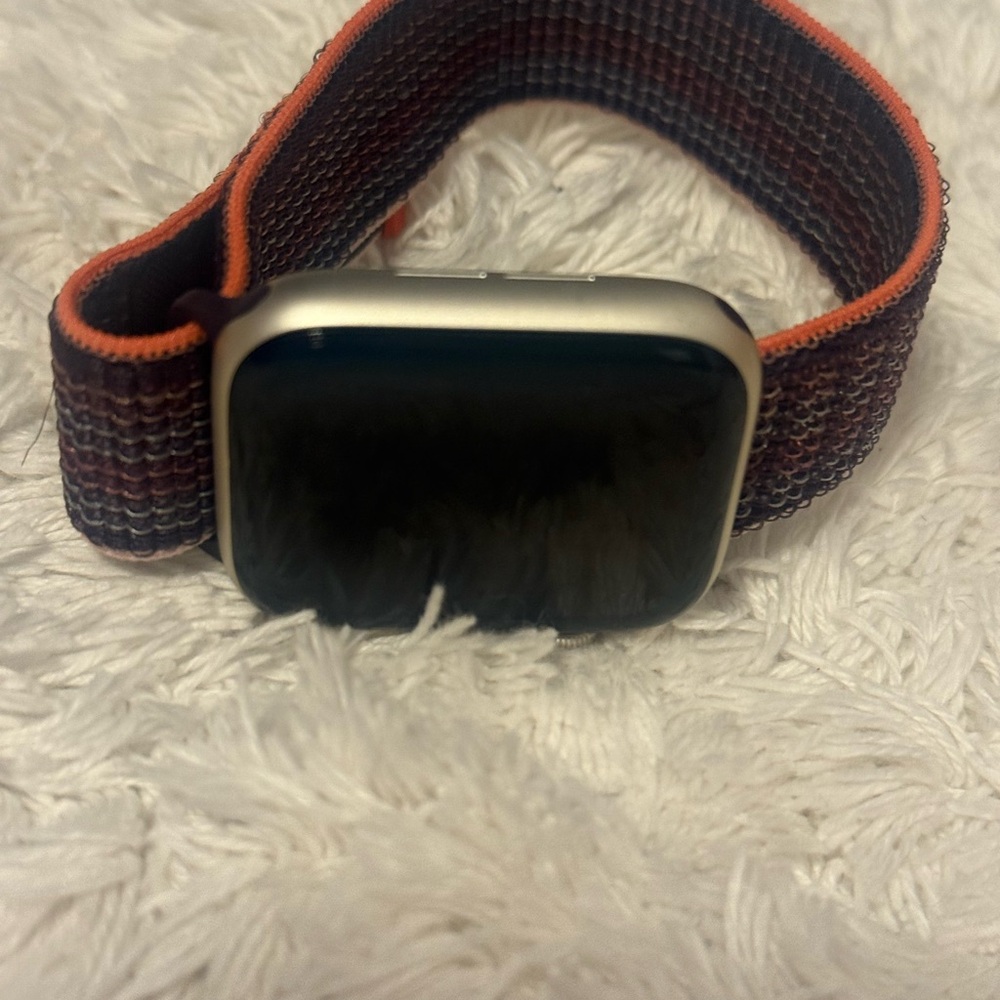 Apple Smartwatch with Black Screen and Orange Band